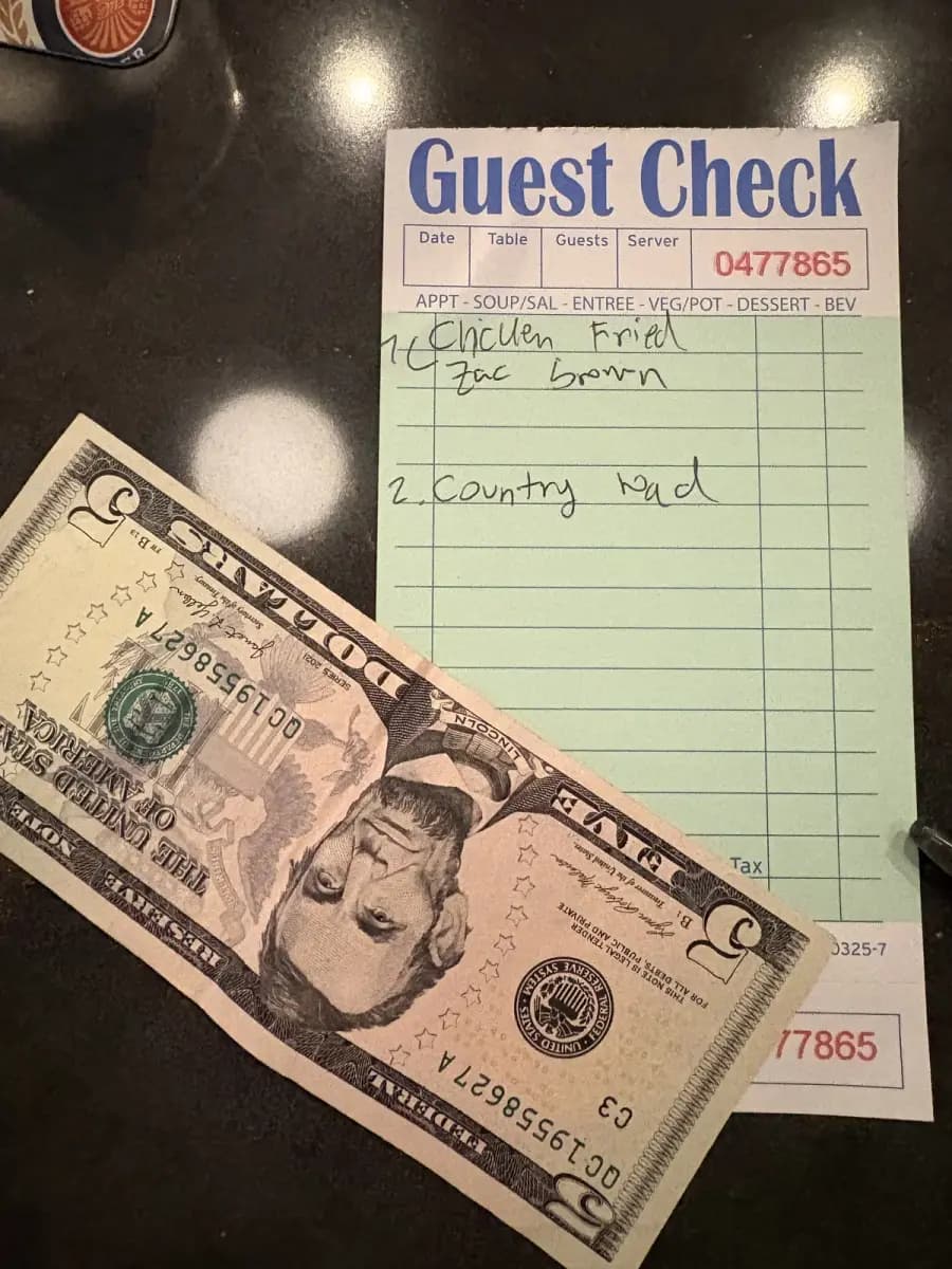 Aya Golf Lounge karaoke guest check showing $2 per song pricing — Chicken Fried and Country Roads written in