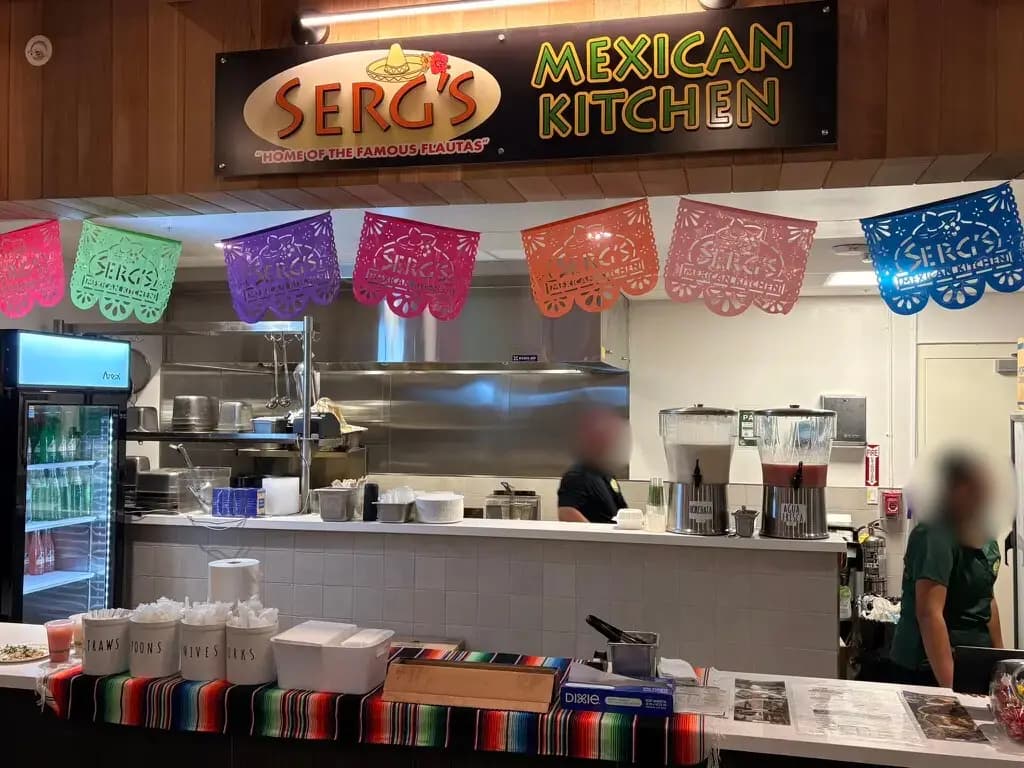 Serg's Mexican Kitchen counter with papel picado decorations at The Park on Keeaumoku Midtown Eats