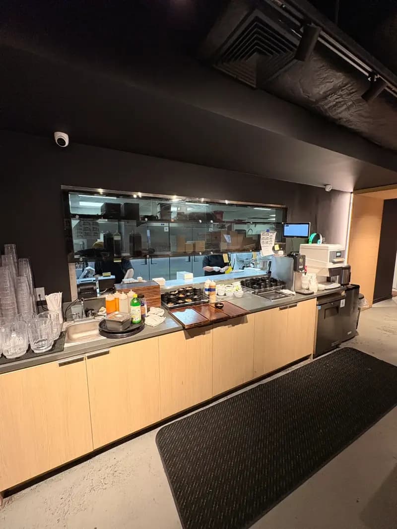 Yakiniku Like Hawaii open kitchen with staff preparing orders behind glass window